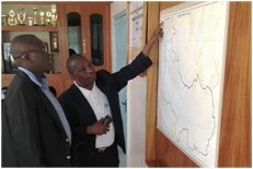Harim Karugendo, Managing Director of EWASCO, shows the map of the pipeline investment project that will bring water to 75,000 residents of Embu, Kenya.